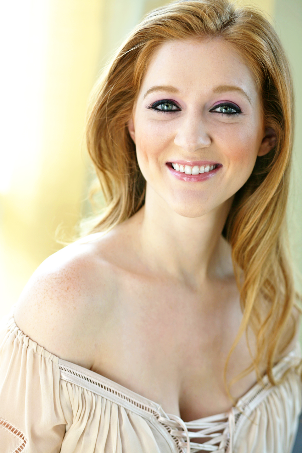 NYC jazz singer Page Lucky in tan off the shoulder top headshot